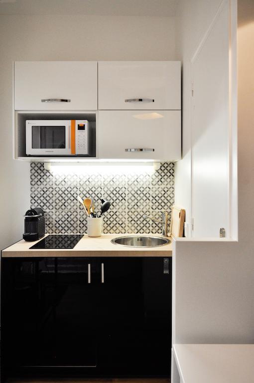 Appartamento Duplex De Charme Au Coeur De Montmartre Parigi Camera foto