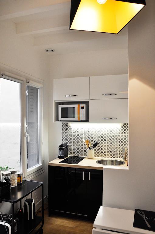 Appartamento Duplex De Charme Au Coeur De Montmartre Parigi Camera foto